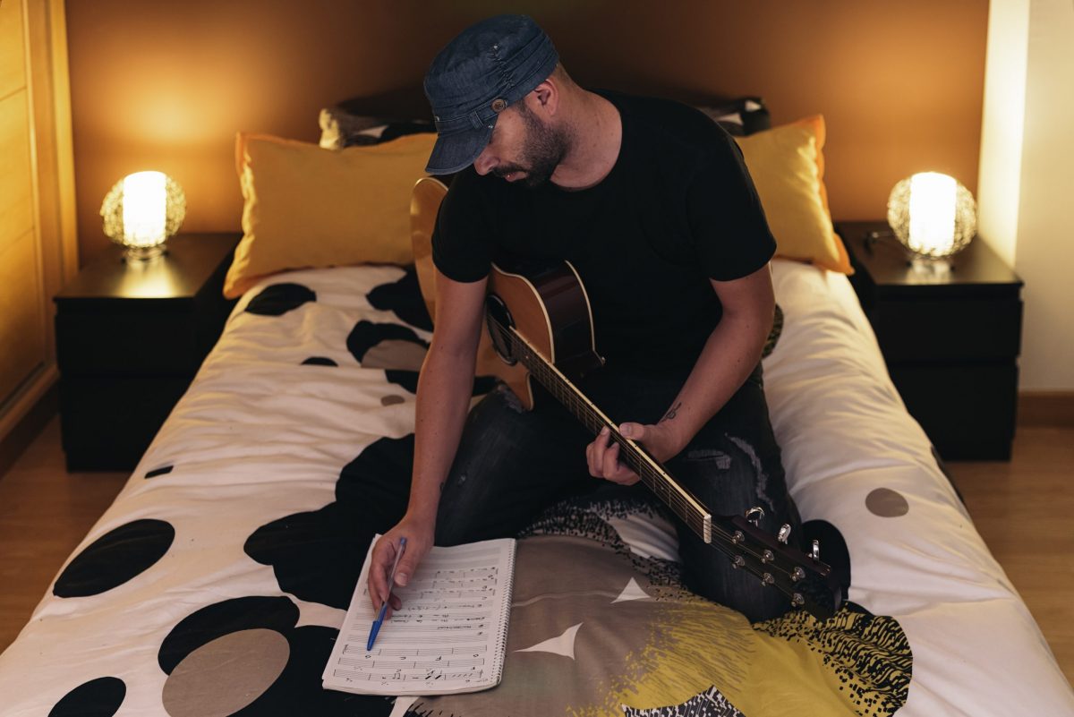 Young man composing music aqunzsh scaled e1609861380150 - voice lessons tips & tricks blog 11